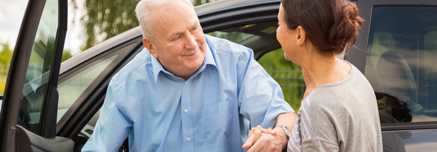 A representative from the Honda Canada Foundation is speaking with woman. 